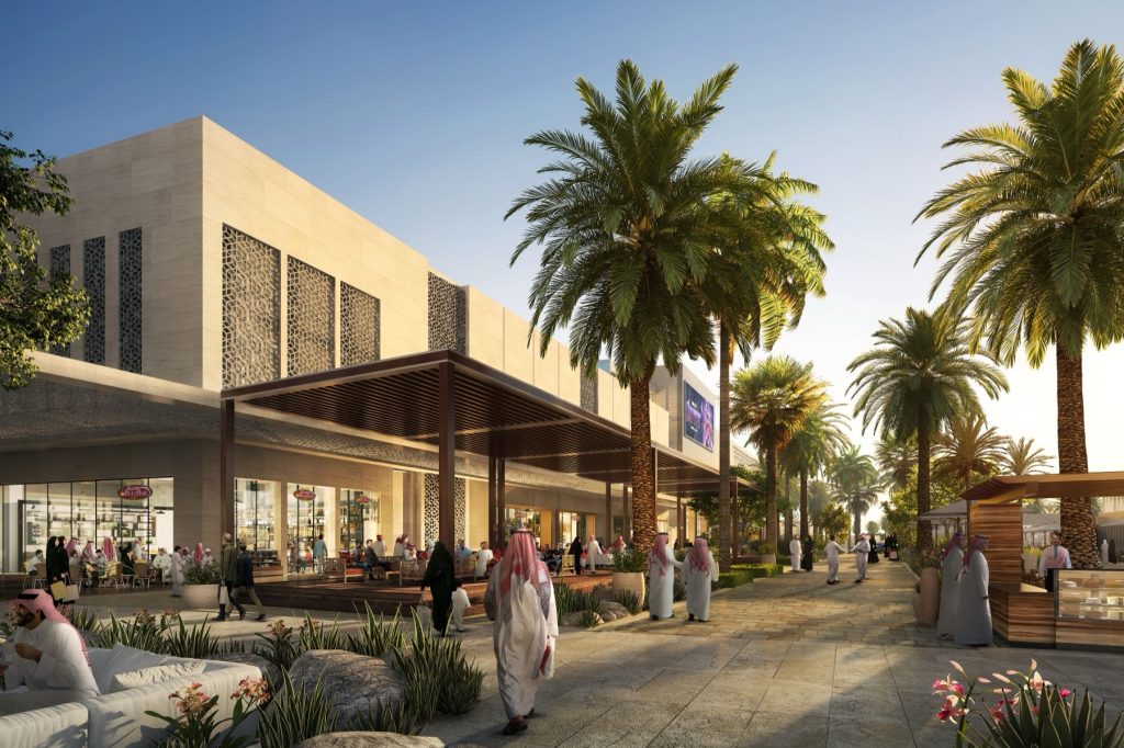 Multaqa Almadinah mall entrance with palm-lined promenade and outdoor seating, Knowledge Economic City, Madinah
