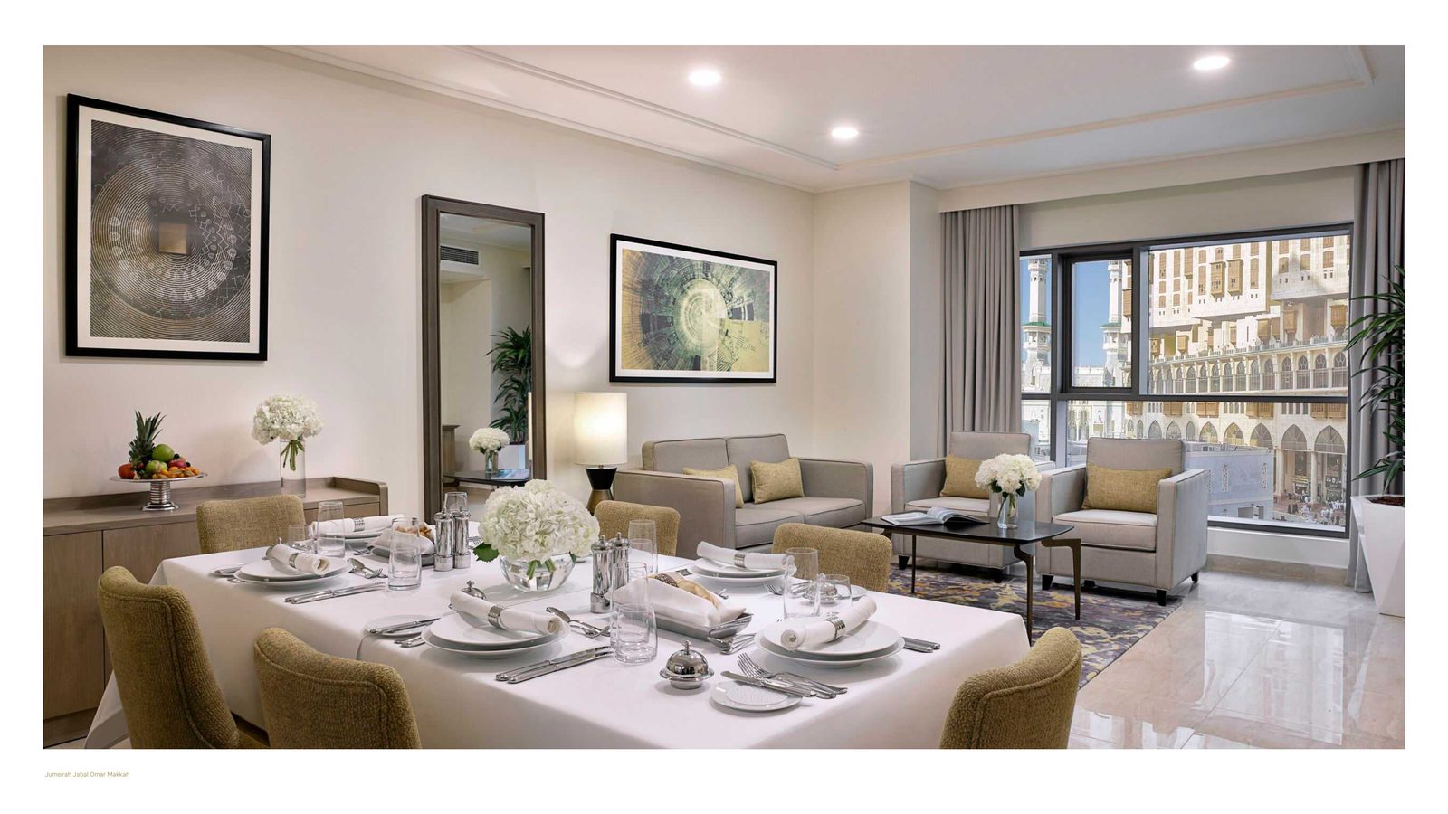 Jumeirah Jabal Omar Makkah &mdash; Living and dining room with floor-to-ceiling views towards Al-Masjid al-Haram